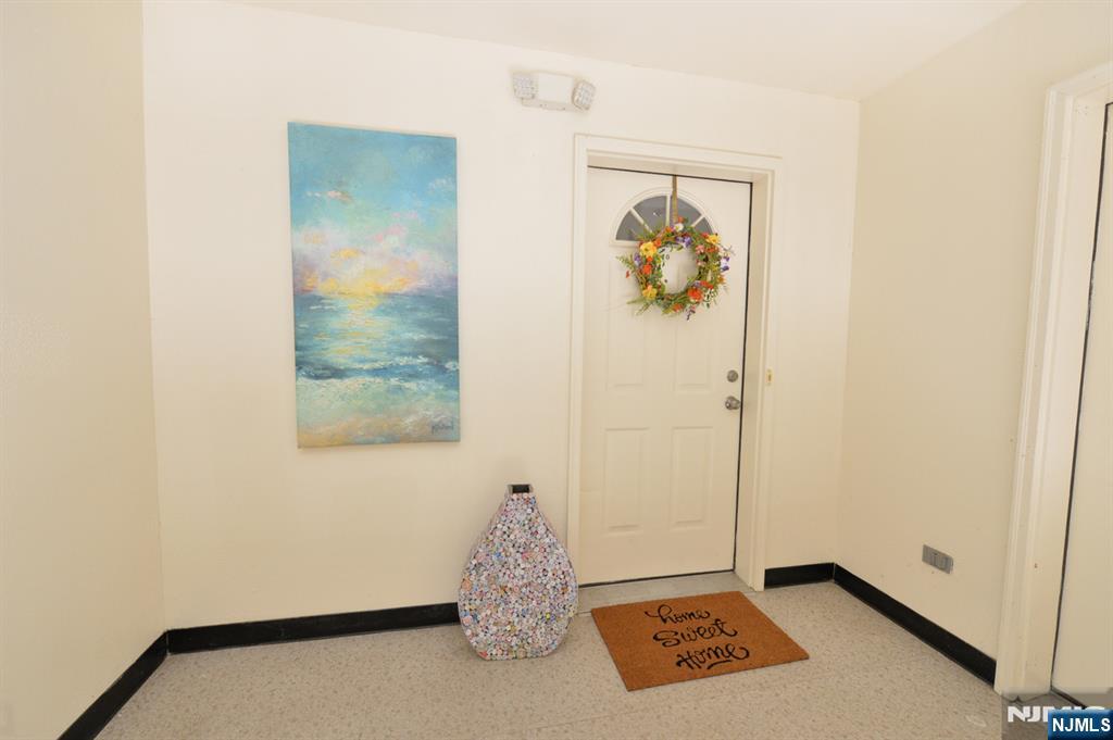 20 Parkside Court Wayne, NJ 07470 - Photo 2 of 22 a view of a hallway with painted walls