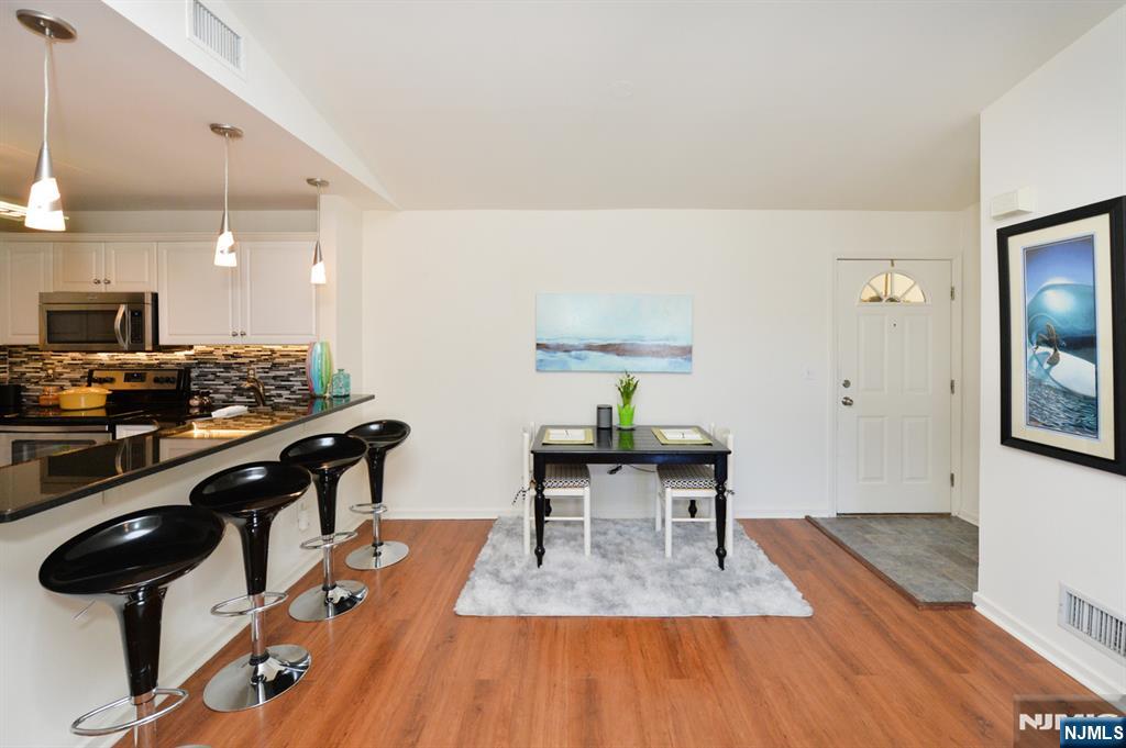 20 Parkside Court Wayne, NJ 07470 - Photo 6 of 22 a living room with furniture and a wooden floor