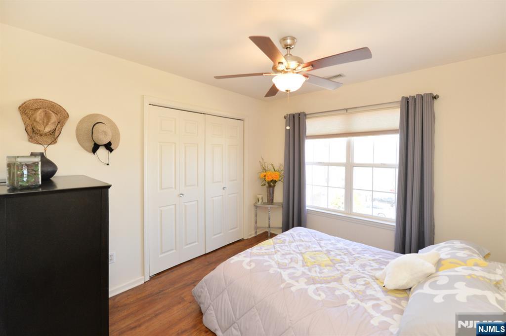 20 Parkside Court Wayne, NJ 07470 - Photo 10 of 22 a bedroom with a bed and a window