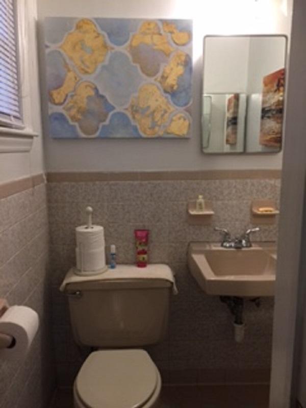 2046 Routt Road Northwest Roanoke, VA 24017 - Photo 14 of 26 a bathroom with a toilet sink and mirror
