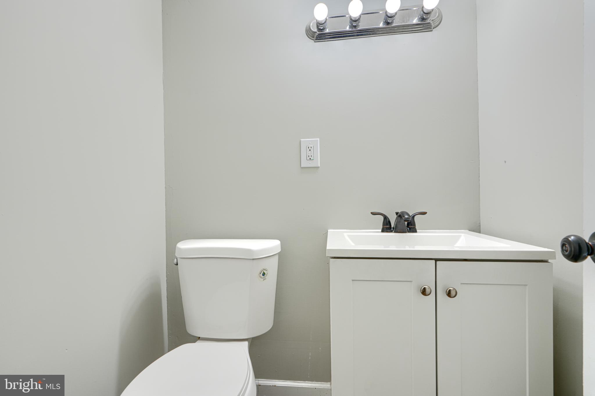 435 Joplin Street Baltimore, MD 21224 - Photo 27 of 30 Sleek and modern half-bath retreat.