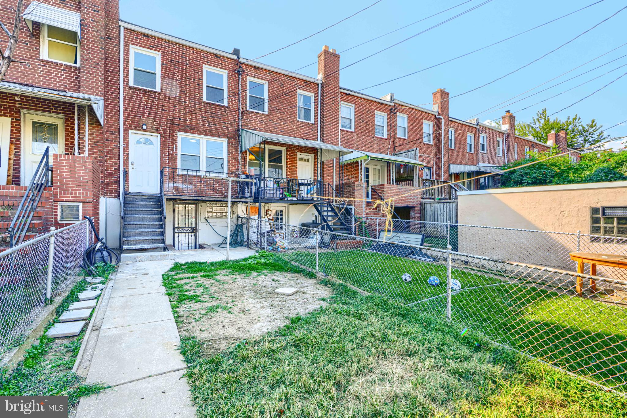 435 Joplin Street Baltimore, MD 21224 - Photo 30 of 30 a view of a brick building next to a yard