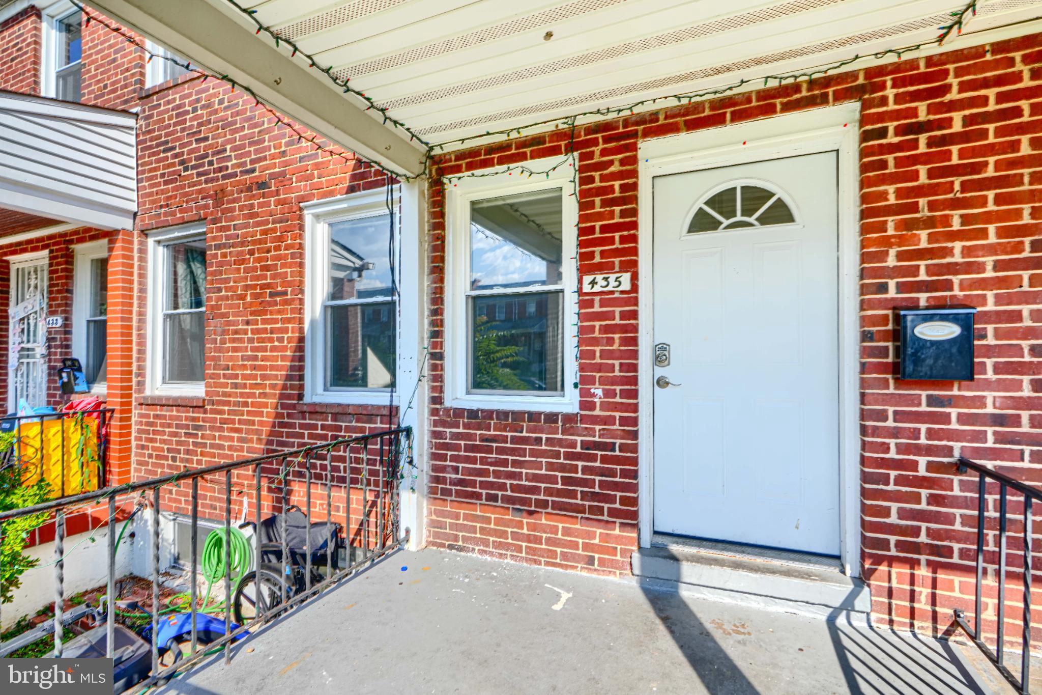 435 Joplin Street Baltimore, MD 21224 - Photo 3 of 30 Charming brick entryway with inviting porch.