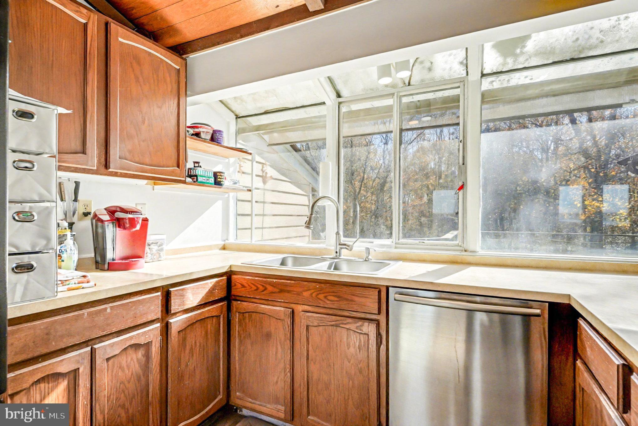 16031 Arthur Road King George, VA 22485 - Photo 13 of 26 a kitchen with granite countertop a sink and a white cabinets