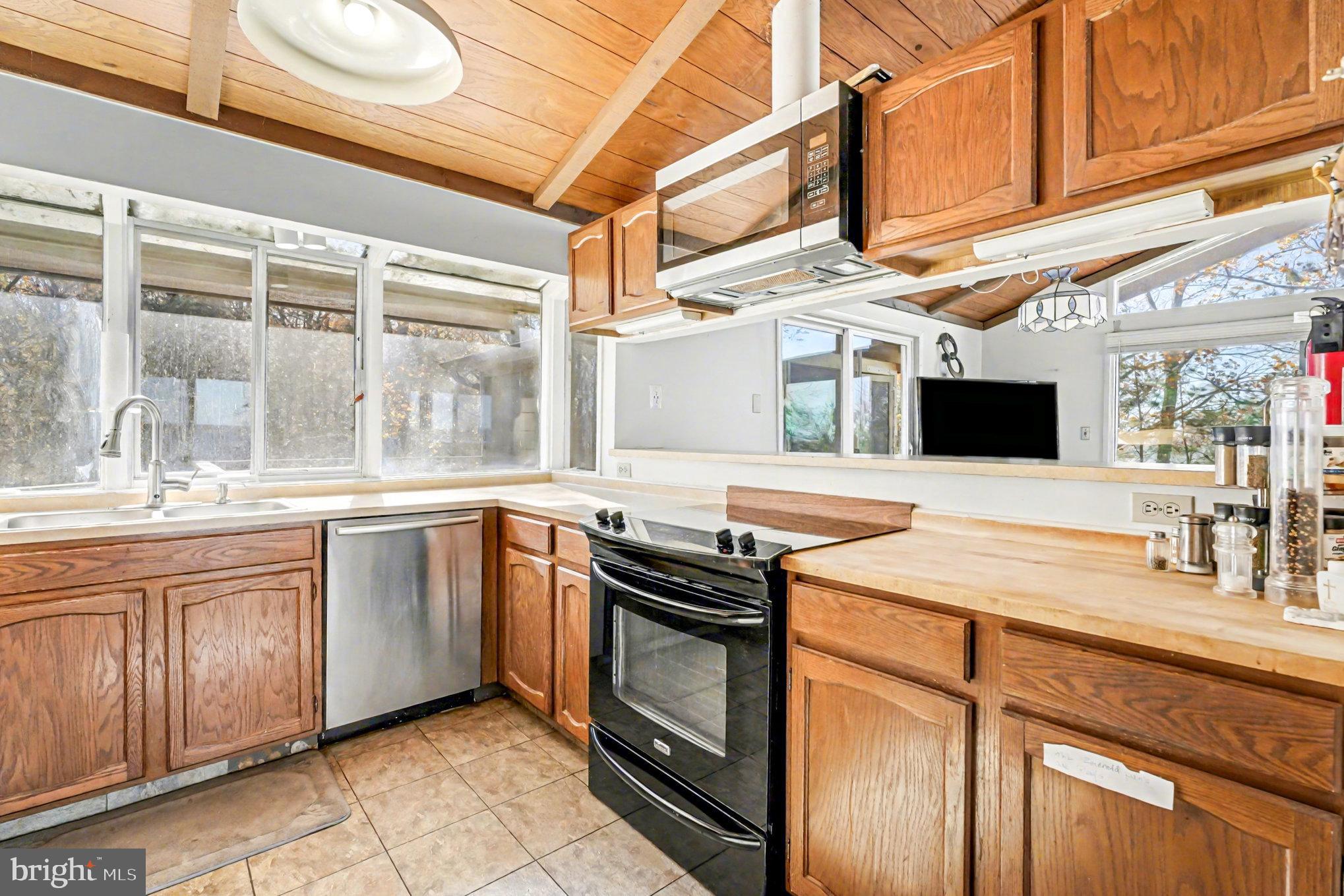 16031 Arthur Road King George, VA 22485 - Photo 14 of 26 a kitchen with stainless steel appliances granite countertop a sink a stove and cabinets