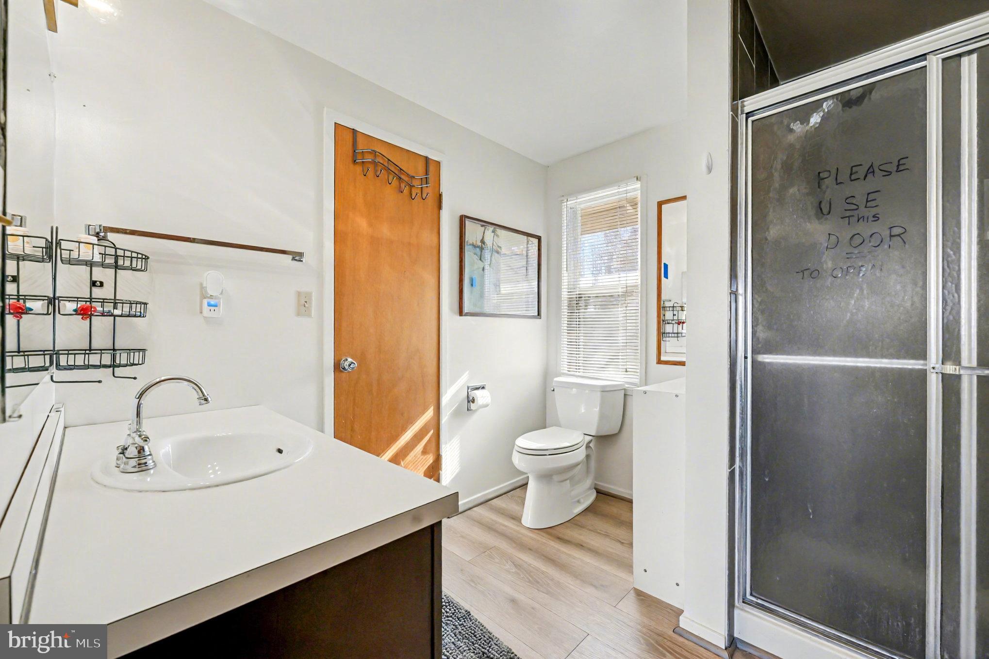 16031 Arthur Road King George, VA 22485 - Photo 16 of 26 a bathroom with a sink toilet and shower
