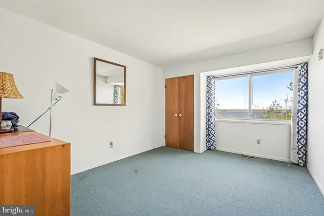 a view of a room with window and cabinet