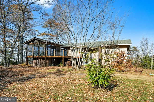 a view of large house with a large tree