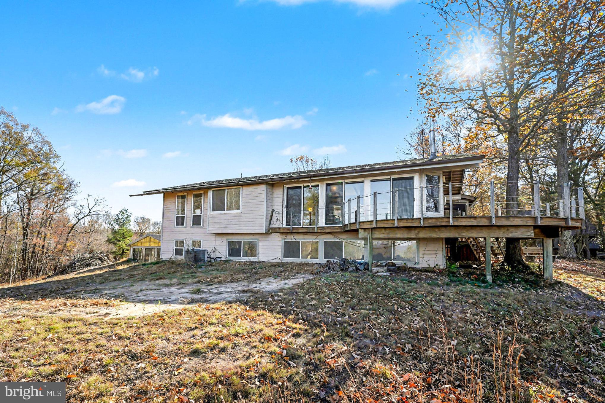 16031 Arthur Road King George, VA 22485 - Photo 23 of 26 a house that has a big yard with plants and large trees