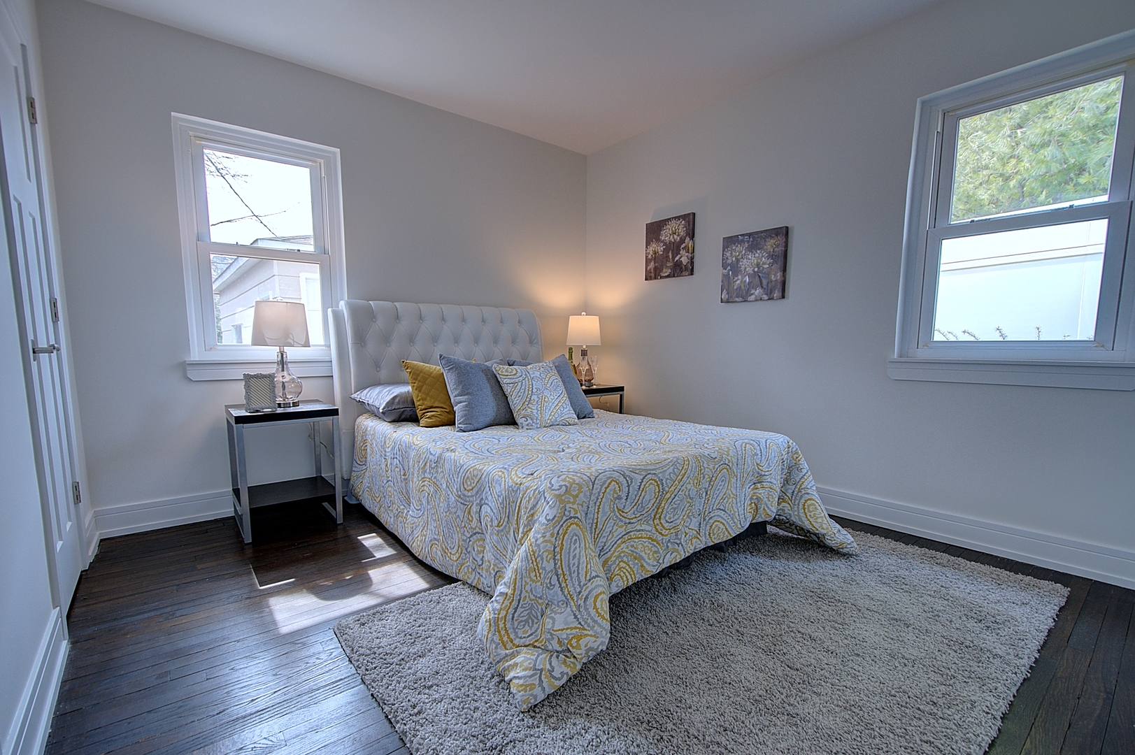 2333 Illinois Road Northbrook, IL 60062 - Photo 11 of 16 a bedroom with a bed and wooden floor