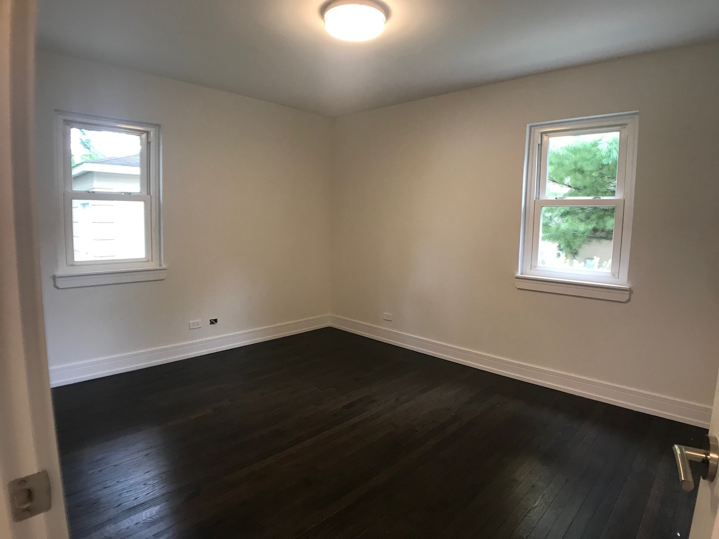 2333 Illinois Road Northbrook, IL 60062 - Photo 12 of 16 an empty room with wooden floor and windows
