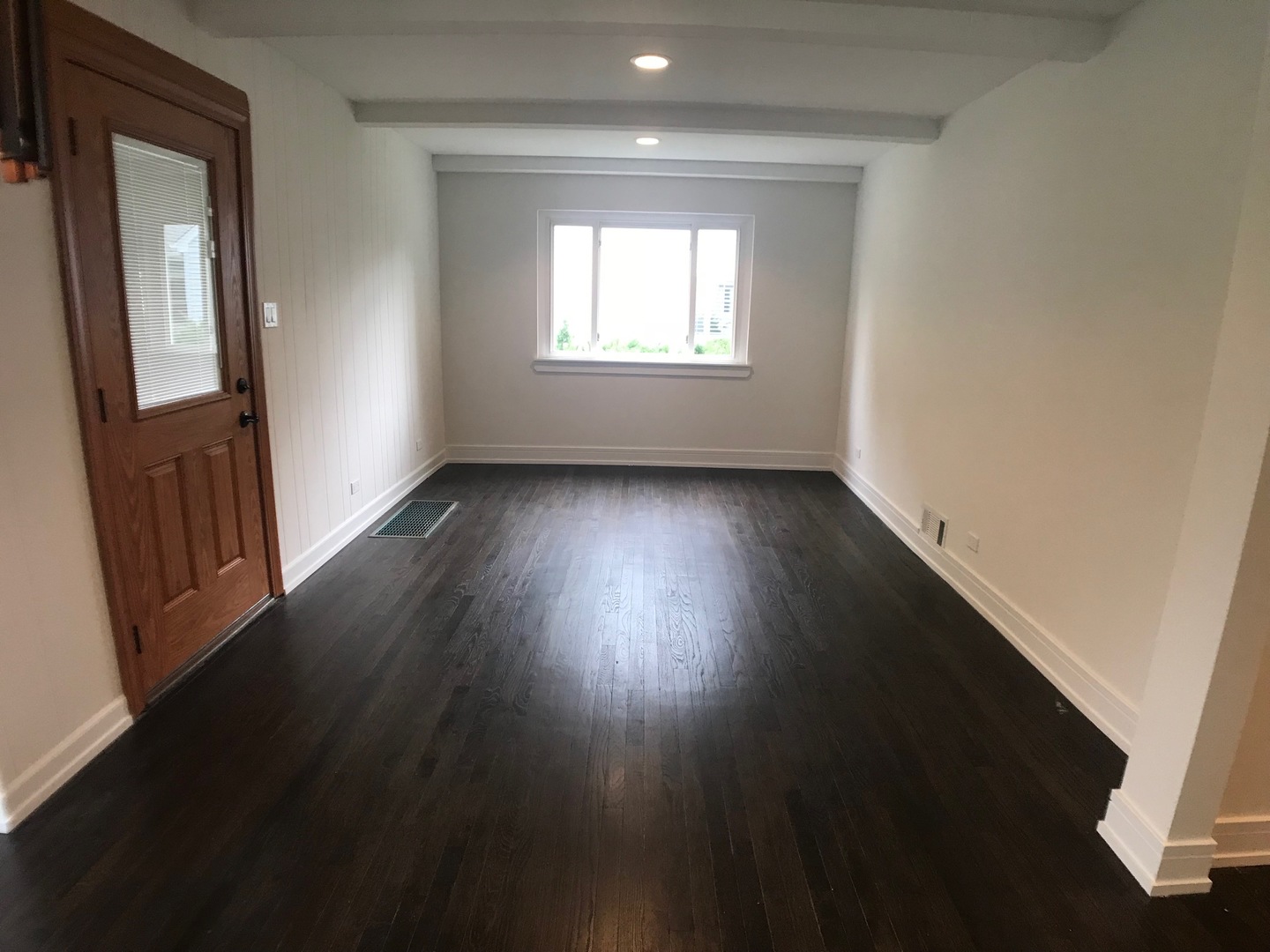 2333 Illinois Road Northbrook, IL 60062 - Photo 7 of 16 an empty room with wooden floor and windows