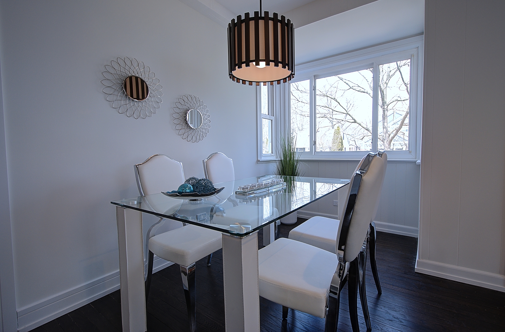 2333 Illinois Road Northbrook, IL 60062 - Photo 8 of 16 a view of a dining room with furniture a chandelier and wooden floor