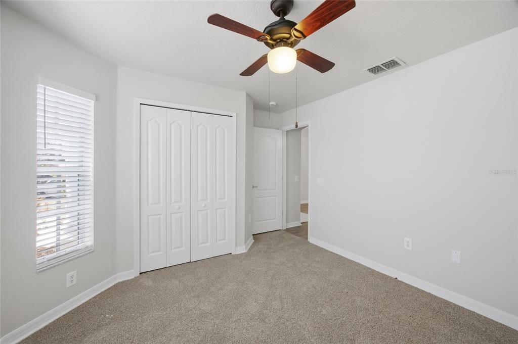 13323 Bainbridge Way Spring Hill, FL 34609 - Photo 17 of 33 a view of an empty room with a window