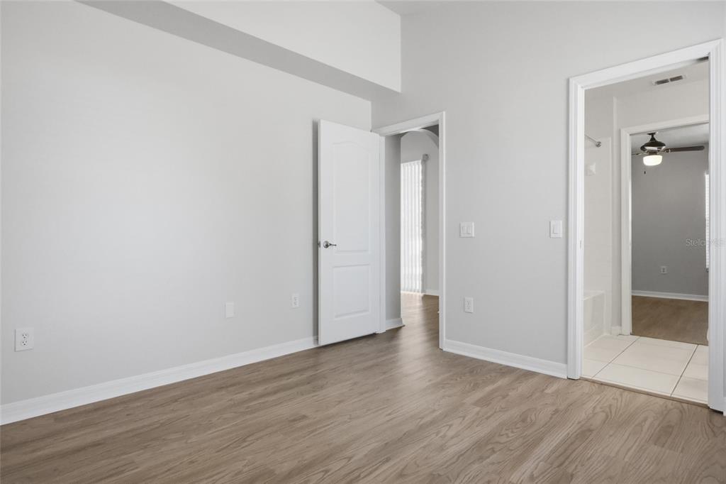 13323 Bainbridge Way Spring Hill, FL 34609 - Photo 20 of 33 an empty room with wooden floor