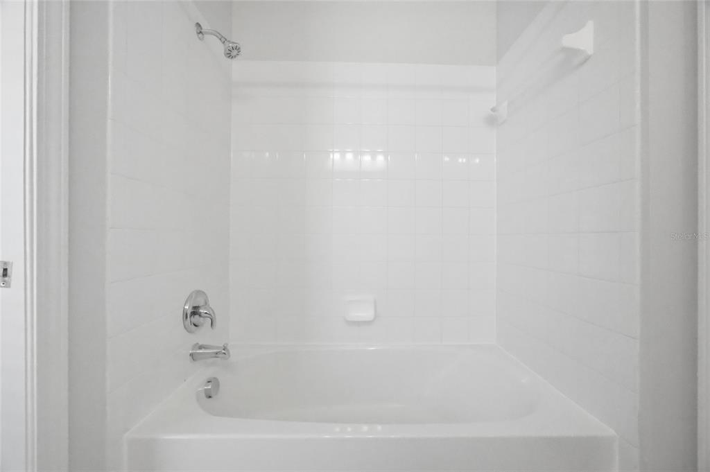 13323 Bainbridge Way Spring Hill, FL 34609 - Photo 22 of 33 a bathroom with a bathtub