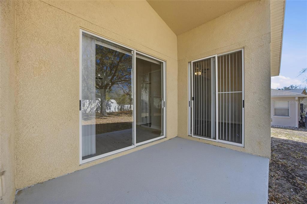 13323 Bainbridge Way Spring Hill, FL 34609 - Photo 26 of 33 a view of a room that has a large window and front door