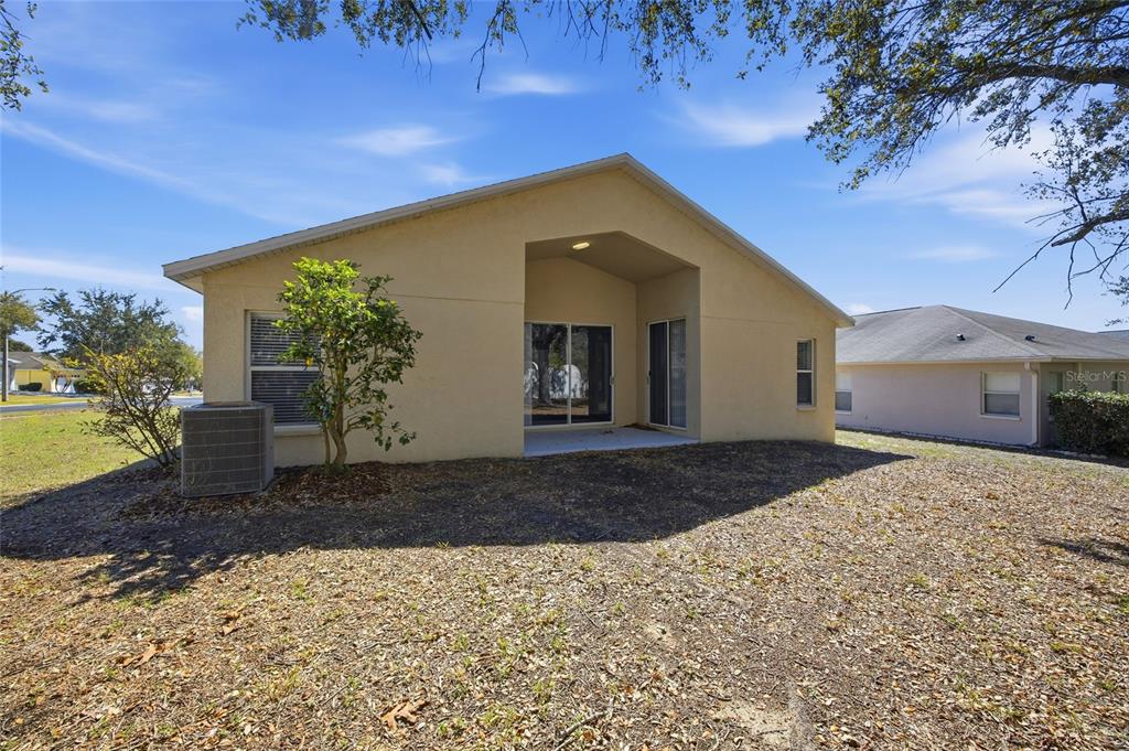 13323 Bainbridge Way Spring Hill, FL 34609 - Photo 27 of 33 a front view of a house with garden