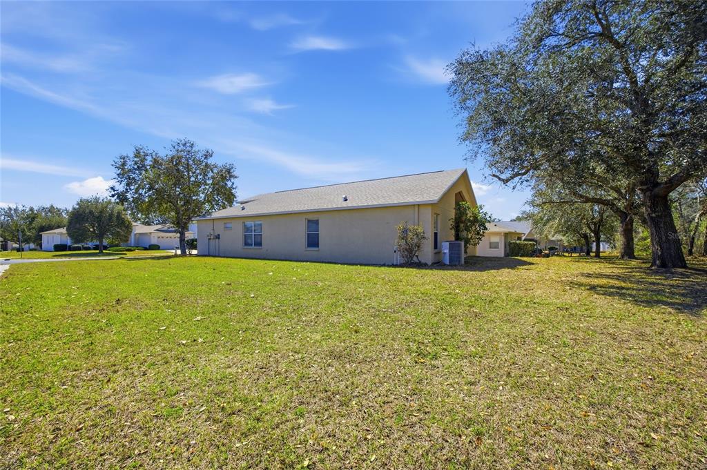 13323 Bainbridge Way Spring Hill, FL 34609 - Photo 28 of 33 a front view of house with yard