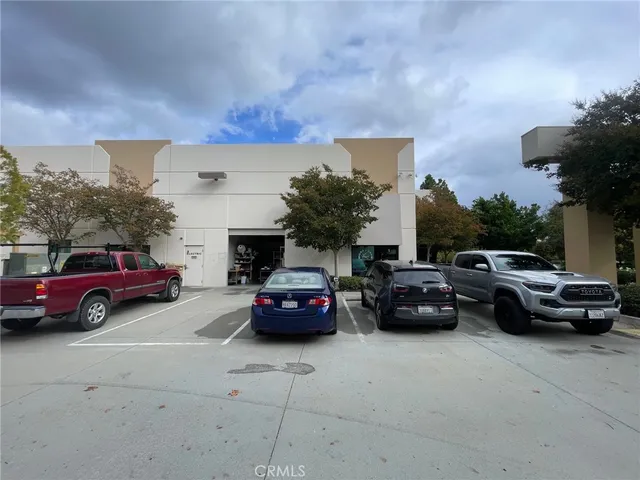 a view of street with parked cars