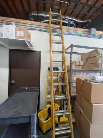 a kitchen with stainless steel appliances granite countertop a refrigerator and a stove