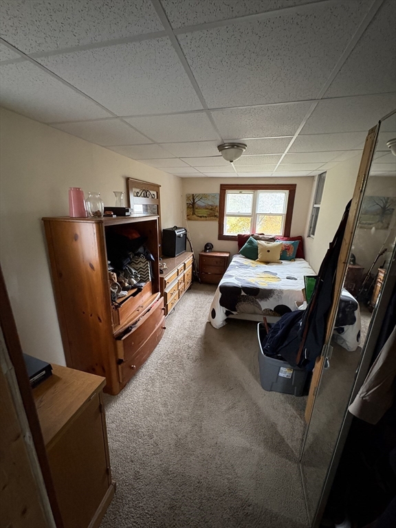 958 Main Street Holyoke, MA 01040 - Photo 13 of 18 a bedroom with furniture and a window