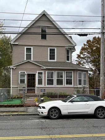 a front view of a house with parking space