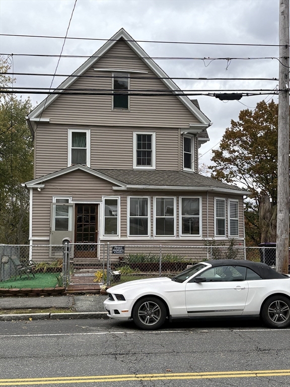 958 Main Street Holyoke, MA 01040 - Photo 2 of 18 a front view of a house with parking space