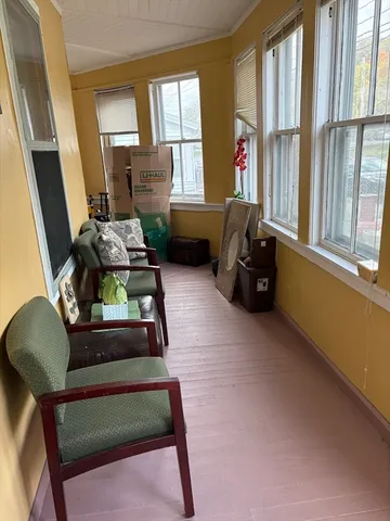 a bed room with furniture and a flat screen tv