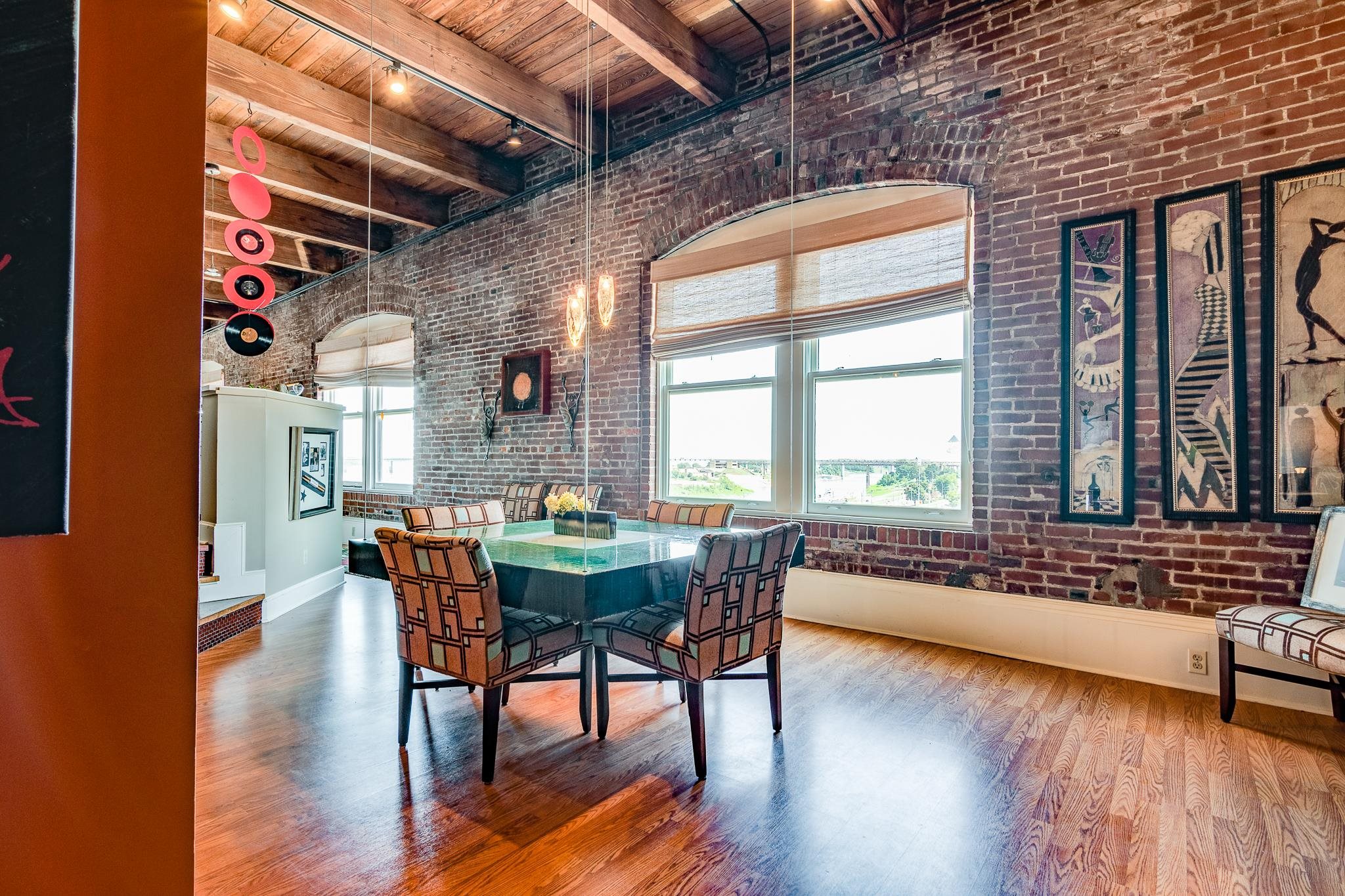 262 Wagner Place, Unit 402 Memphis, TN 38103 - Photo 31 of 40 a view of a dining room with furniture window and wooden floor