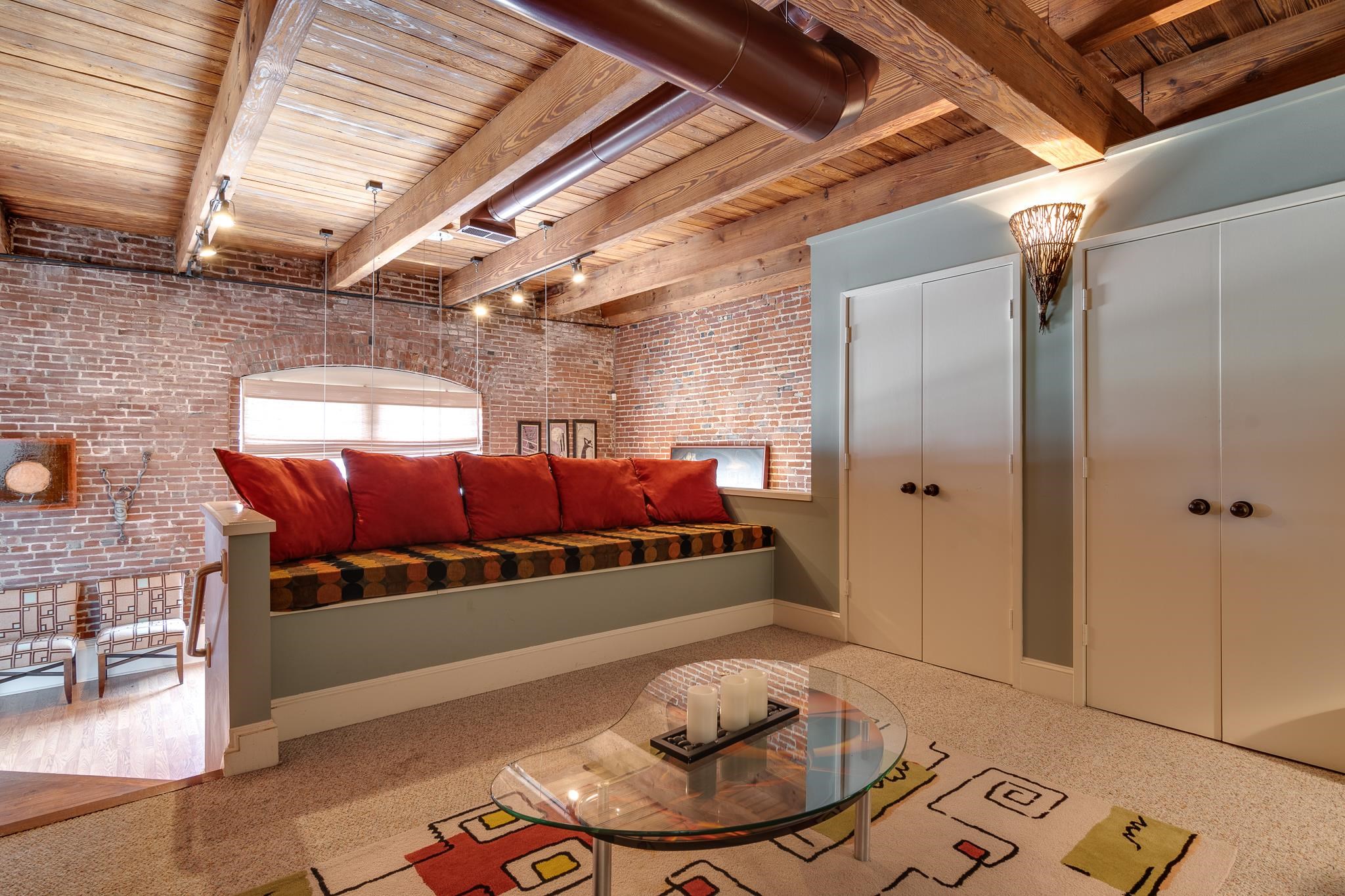 262 Wagner Place, Unit 402 Memphis, TN 38103 - Photo 5 of 40 a bed room with a bed and a table