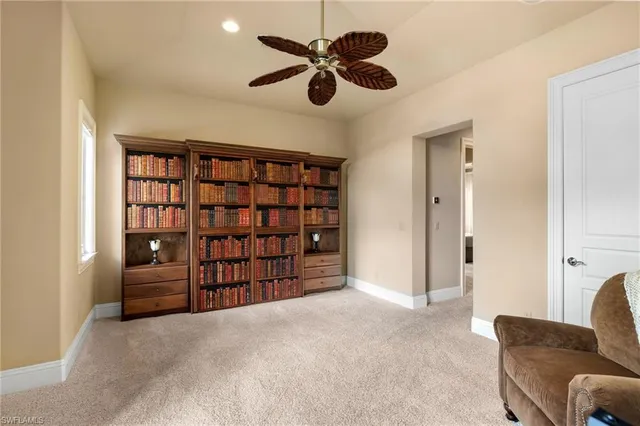 a bathroom with a granite countertop sink toilet and mirror