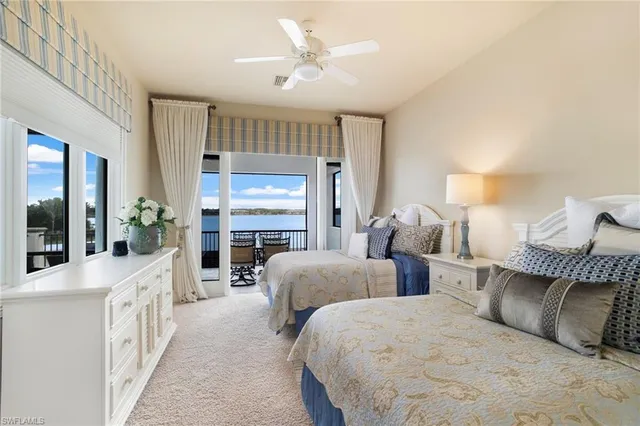 a view of a balcony with lake view and wooden floor