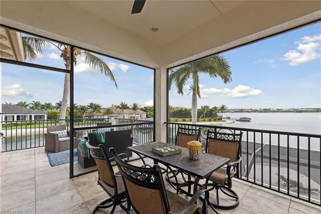 a bathroom with a granite countertop sink mirror and a bathtub