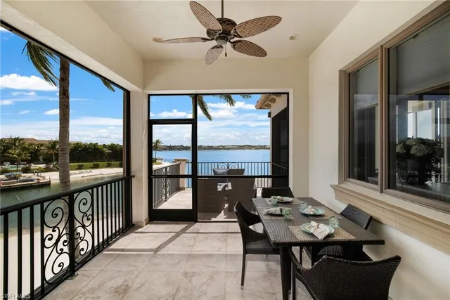 a view of a patio with a dining table and chairs
