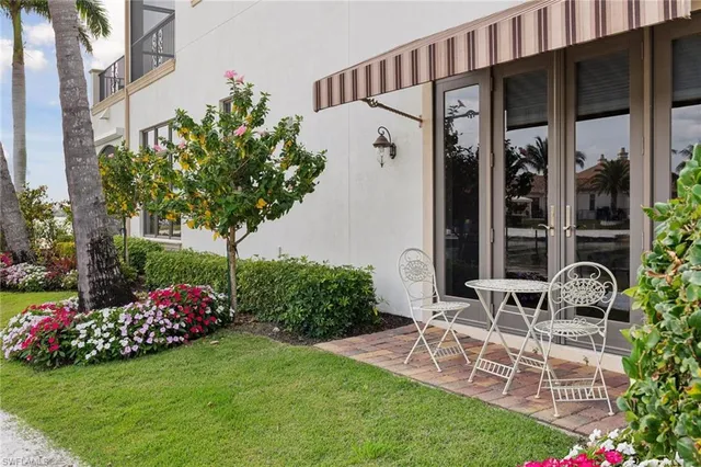 a view of a swimming pool and lounge chairs
