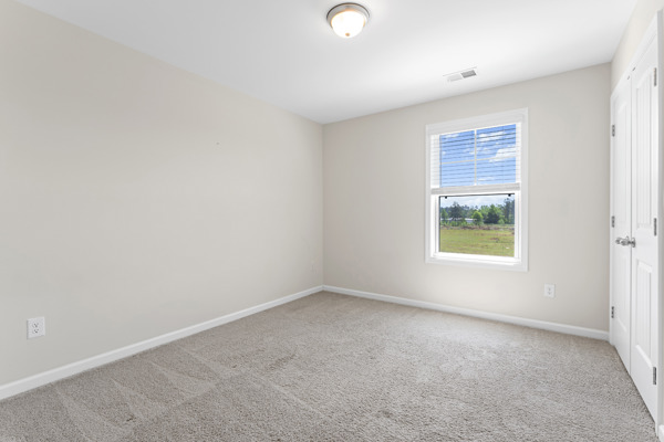 249 Samuel Street Pendleton, SC 29670 - Photo 20 of 33 Bedroom#3 This bright bedroom offers tranquil outdoor views and comfortable carpet flooring, ready for personalization.