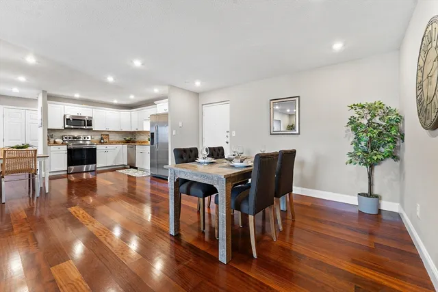 a kitchen with a table and chairs in it