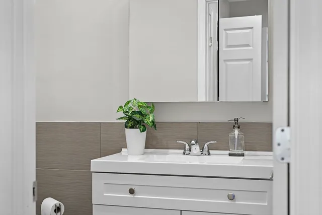 a close view of sink and cabinets