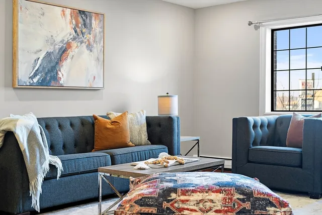 a bedroom with bed and a couch