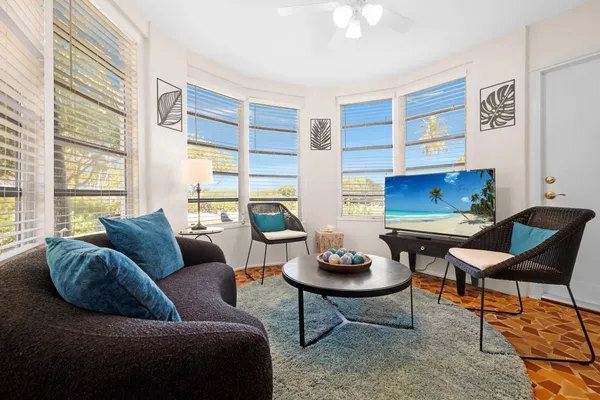 a living room with furniture and a chair