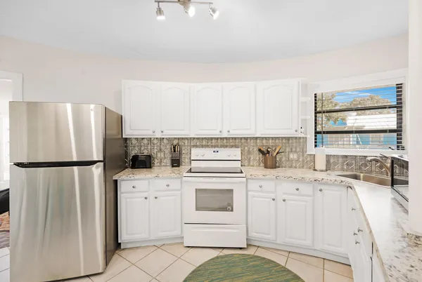 a view of kitchen with furniture and window