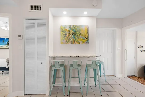 a kitchen with cabinets and window