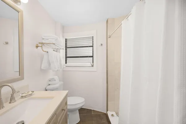 a bathroom with a sink toilet and vanity