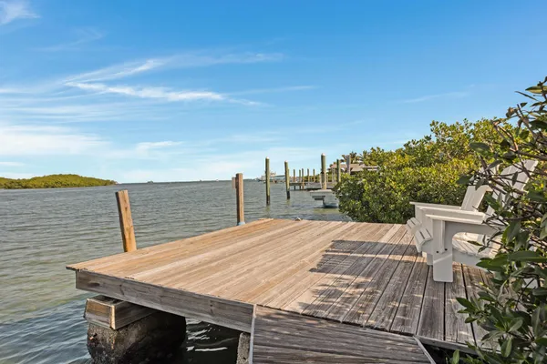 a view of a swimming pool with an outdoor seating and a garden