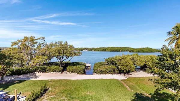 a view of a lake with a yard