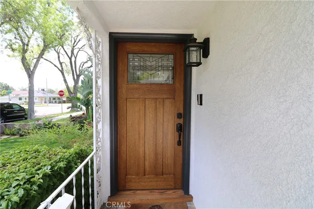 a view of a door and wooden floor