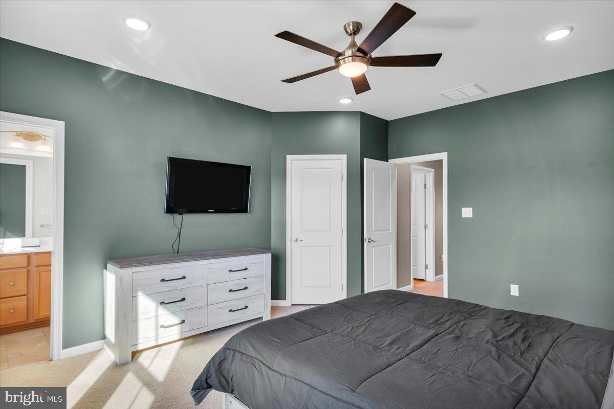 262 Iannelli Road Clarksboro, NJ 08020 - Photo 19 of 39 a bedroom with a bed and a flat screen tv