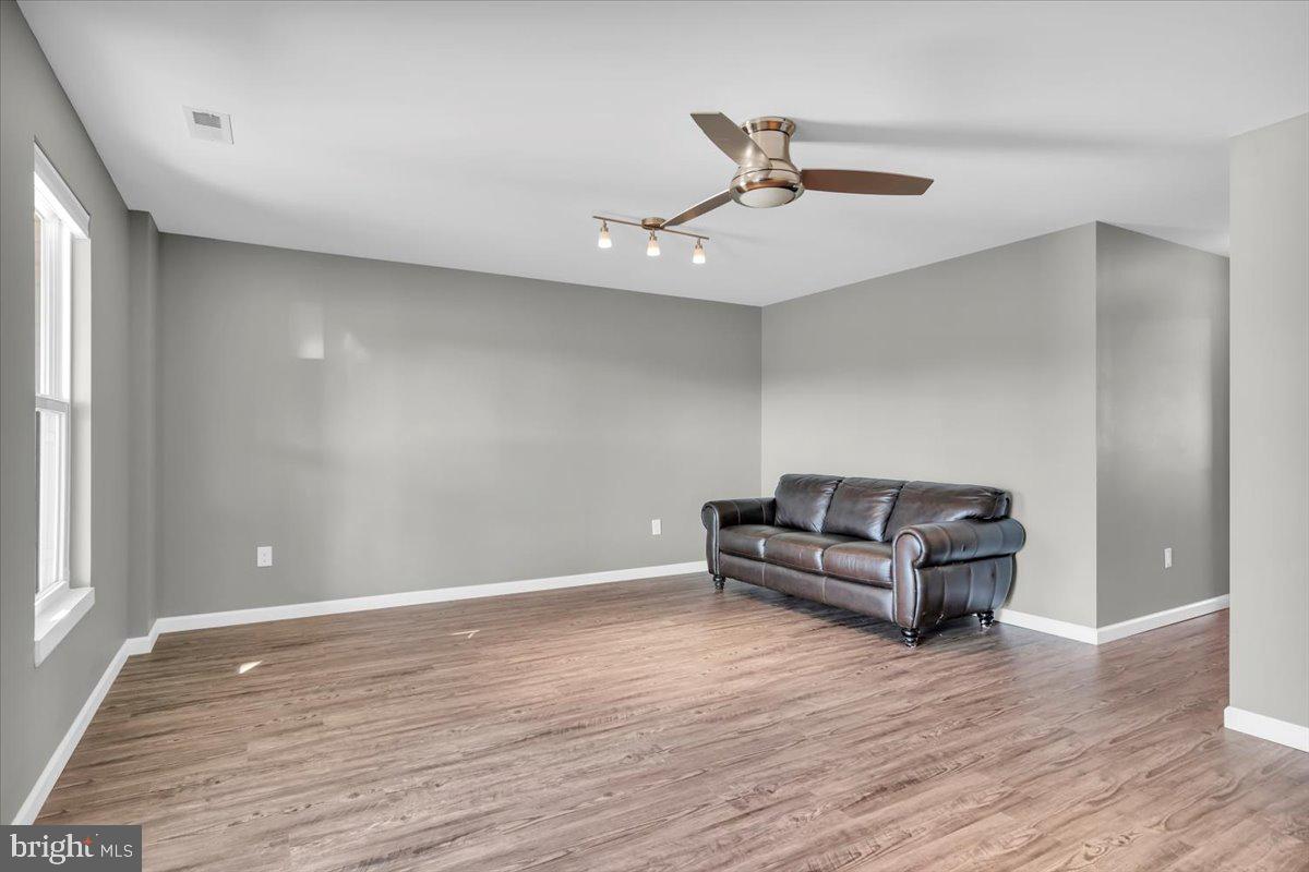 262 Iannelli Road Clarksboro, NJ 08020 - Photo 8 of 39 a living room with furniture and a wooden floor