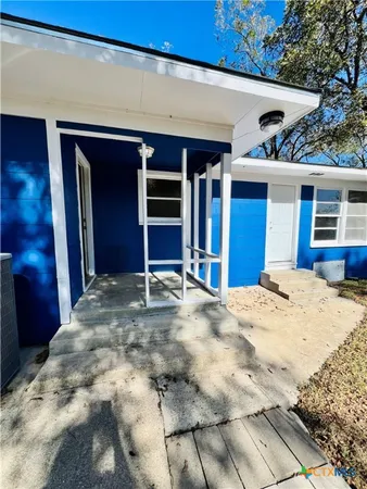 a view of a house with a patio